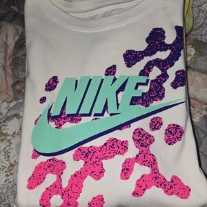 3 Nike Graphic Tee with Pink & Teal, Gray & Blue, And Pink & Yellow Design